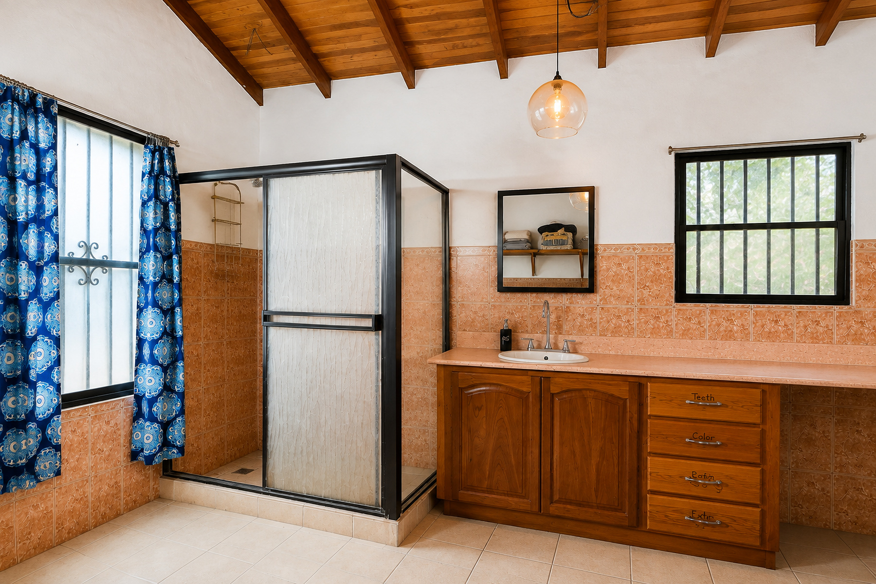 Bathroom with a walk-in shower and wood vanity