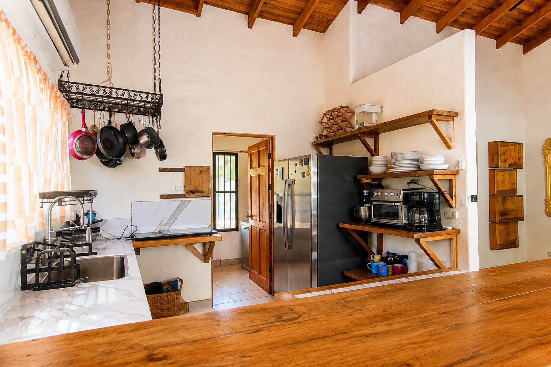 Kitchen with open shelves and wood counters