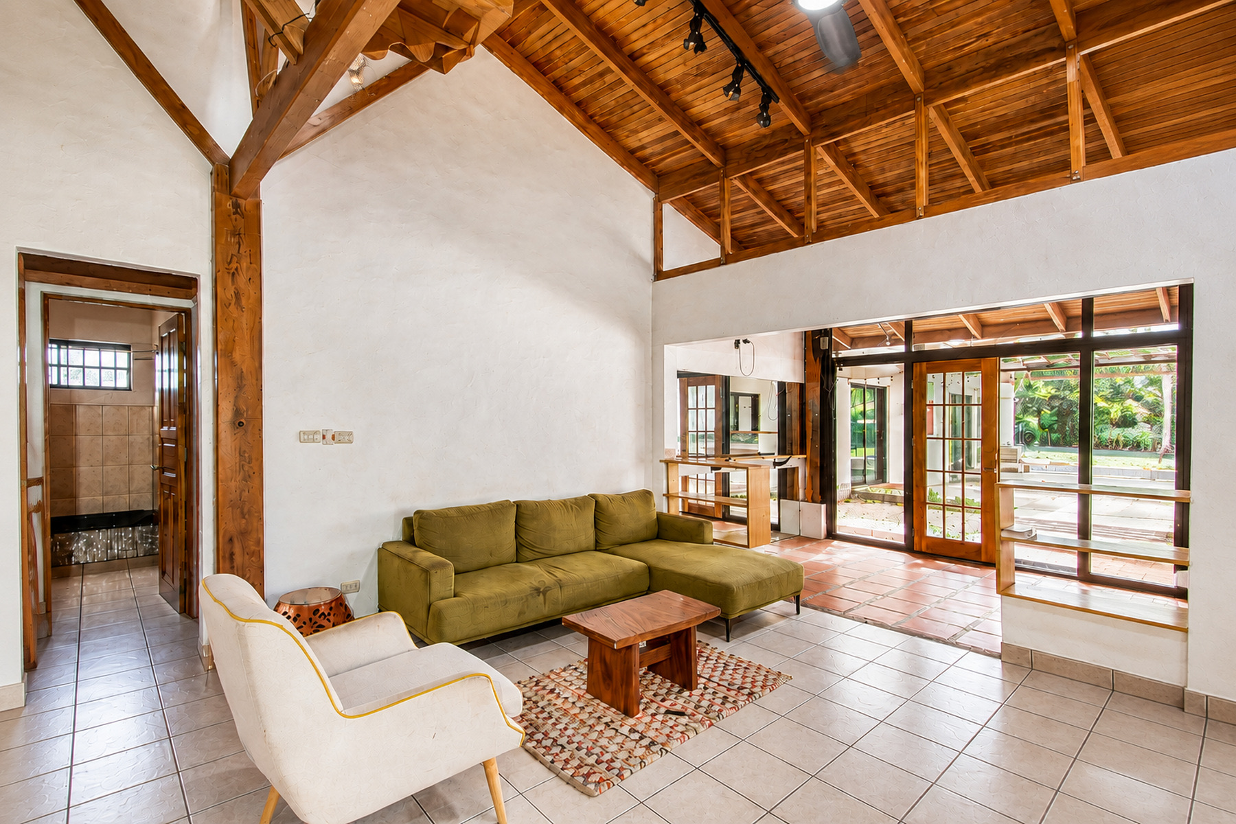 Living room under a vaulted wood ceiling